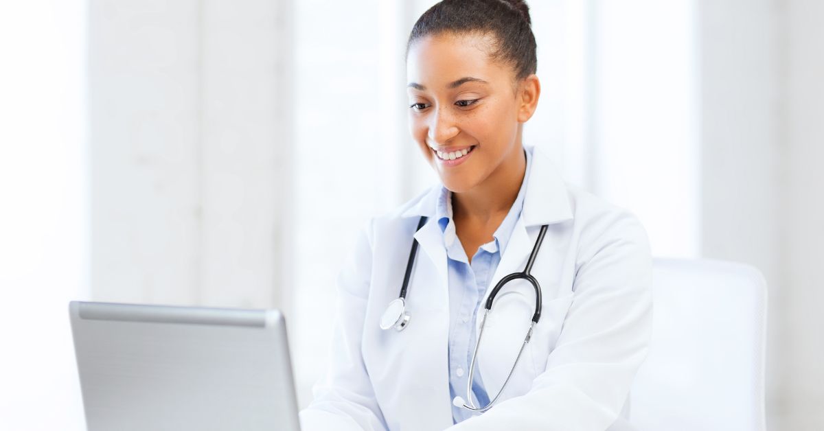 medical professional working on a laptop